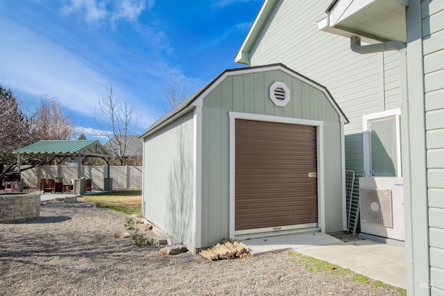 view of shed with fence