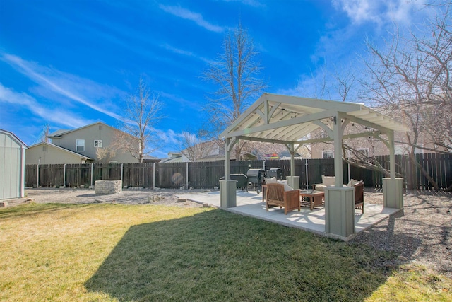 view of yard with a patio area, a fenced backyard, and a gazebo