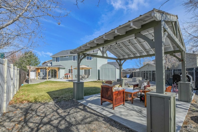 view of patio with a fenced backyard, a storage shed, an outdoor hangout area, an outdoor structure, and a gazebo