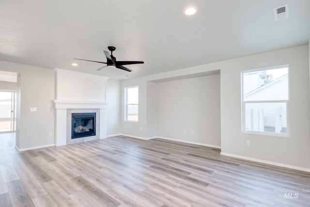 unfurnished living room featuring visible vents, baseboards, ceiling fan, light wood-type flooring, and recessed lighting