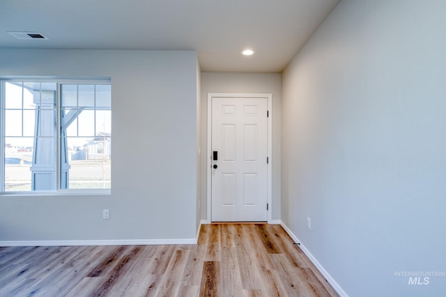 entrance foyer with recessed lighting, baseboards, visible vents, and light wood-type flooring