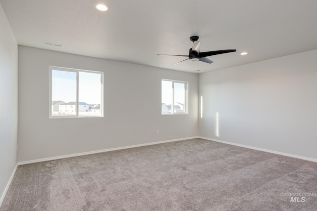 unfurnished room featuring recessed lighting, baseboards, carpet, and a ceiling fan