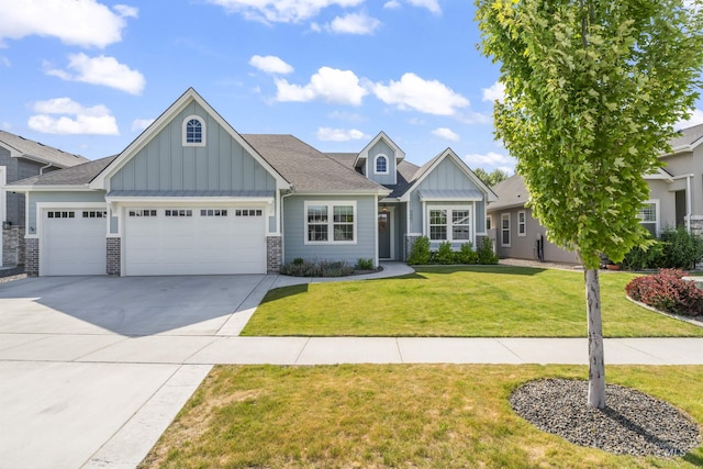 5001 S Twilight Mist Way, Meridian, ID 83642 - craftsman inspired home featuring board and batten siding, a garage, driveway, a front yard, and stone siding