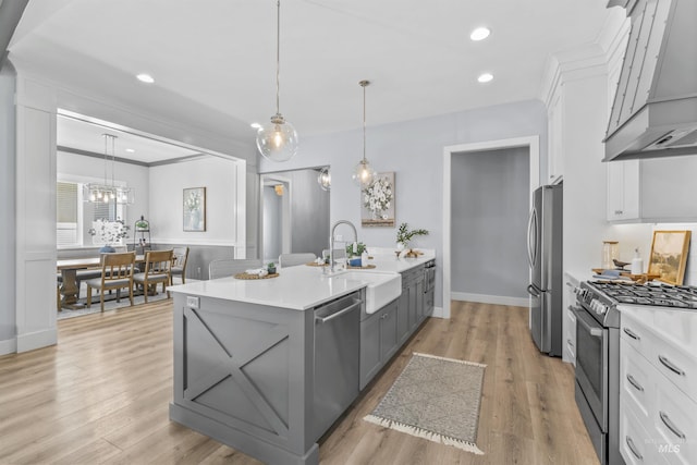 5001 S Twilight Mist Way, Meridian, ID 83642 - kitchen with appliances with stainless steel finishes, custom range hood, gray cabinetry, light countertops, and white cabinets