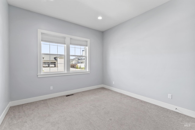 5001 S Twilight Mist Way, Meridian, ID 83642 - carpeted spare room featuring baseboards and recessed lighting