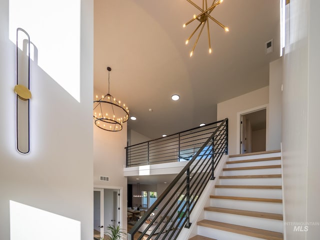 1590 N Watershed Ln, Star, ID 83669 - stairs with a towering ceiling, a chandelier, and recessed lighting