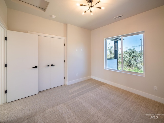 1590 N Watershed Ln, Star, ID 83669 - unfurnished bedroom featuring light carpet, baseboards, and a closet