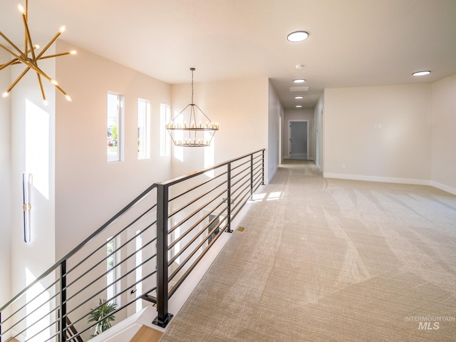 1590 N Watershed Ln, Star, ID 83669 - hallway featuring a chandelier, an upstairs landing, baseboards, recessed lighting, and carpet floors