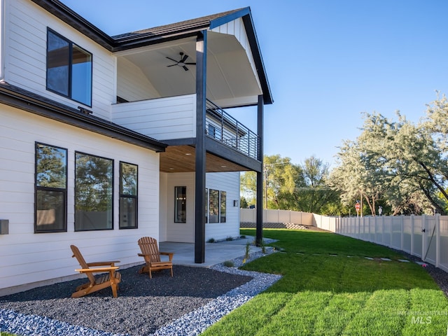 1590 N Watershed Ln, Star, ID 83669 - back of property with a balcony, ceiling fan, and a patio area