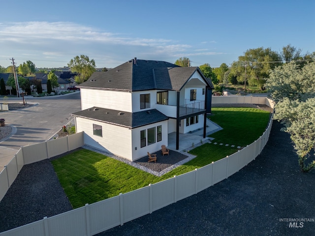 1590 N Watershed Ln, Star, ID 83669 - view of side of home featuring roof with shingles, a patio, and a balcony