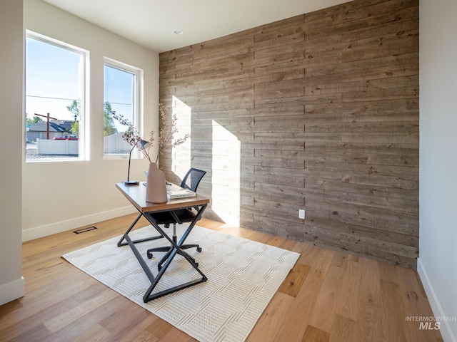 1590 N Watershed Ln, Star, ID 83669 - home office with baseboards, wood walls, and wood finished floors
