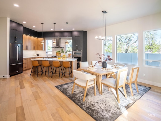 1590 N Watershed Ln, Star, ID 83669 - dining space with light wood-style floors, recessed lighting, and a chandelier