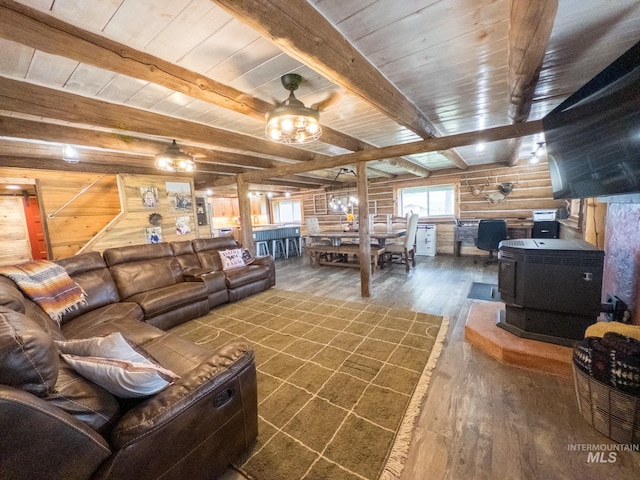 2263 Kilborn Ln, Mesa, ID 83632 - living room featuring dark wood-style floors, a wood stove, wooden ceiling with exposed beams, and ceiling fan