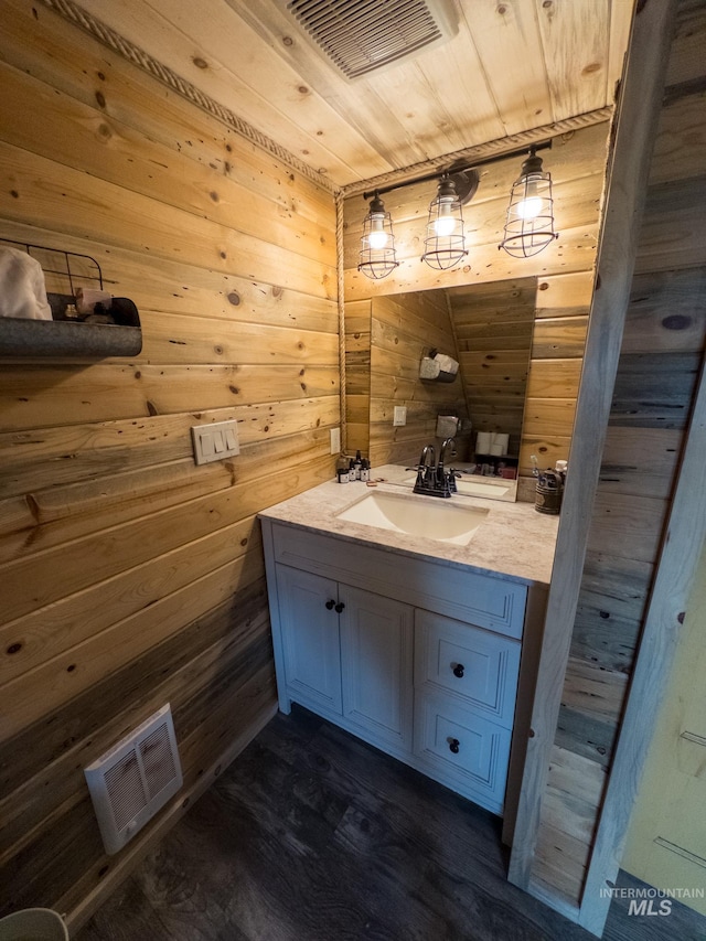2263 Kilborn Ln, Mesa, ID 83632 - bathroom with wooden walls, vanity, wood finished floors, and wood ceiling