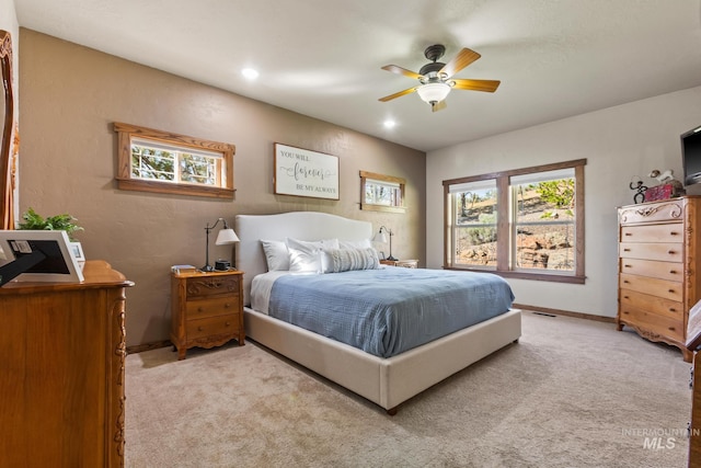 bedroom with light carpet, baseboards, a ceiling fan, and recessed lighting