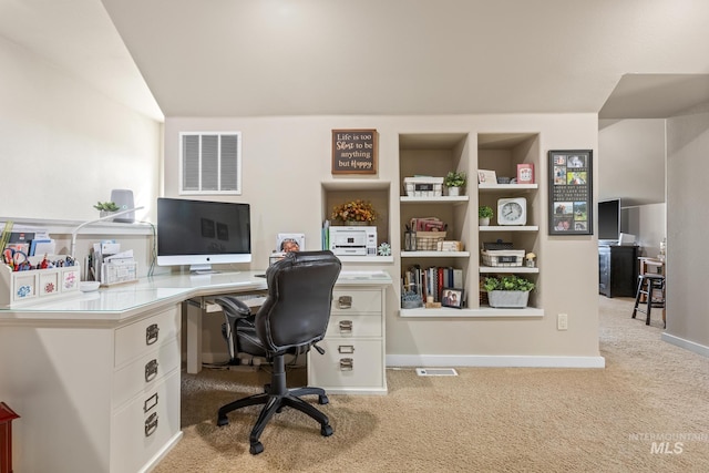 office space with light carpet and baseboards