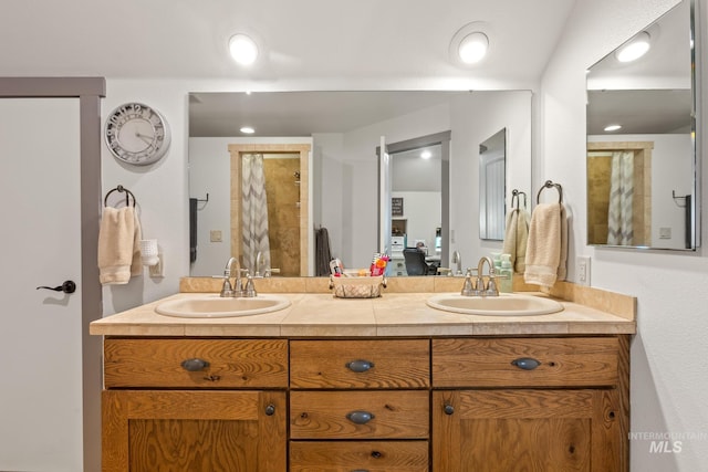 ensuite bathroom with double vanity and tiled shower