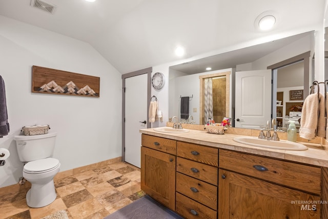 full bath featuring vaulted ceiling, toilet, double vanity, and baseboards