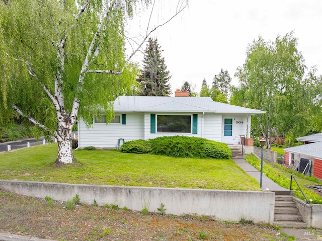 904 Lewis St, Moscow, ID 83843 - view of front of property with a front yard and a chimney