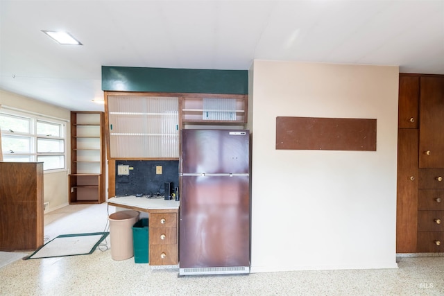 904 Lewis St, Moscow, ID 83843 - kitchen with freestanding refrigerator, speckle patterned floor, and baseboards