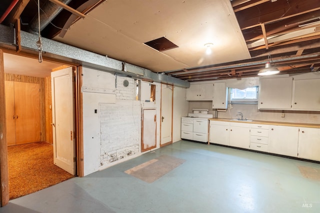 904 Lewis St, Moscow, ID 83843 - below grade area featuring a sink and independent washer and dryer
