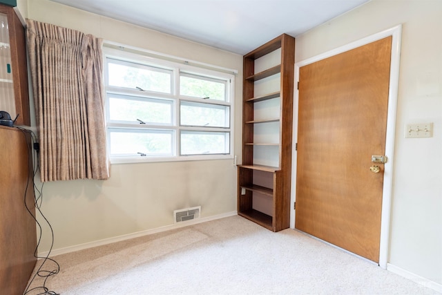 904 Lewis St, Moscow, ID 83843 - unfurnished bedroom with multiple windows, baseboards, and carpet floors
