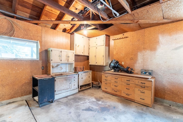904 Lewis St, Moscow, ID 83843 - miscellaneous room featuring unfinished concrete flooring and lofted ceiling