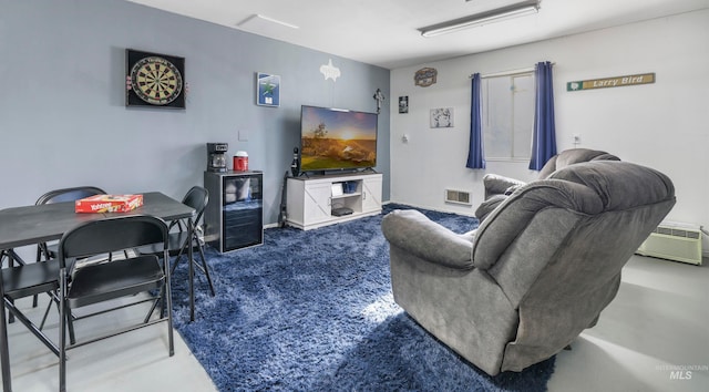 carpeted living room featuring a wall mounted air conditioner