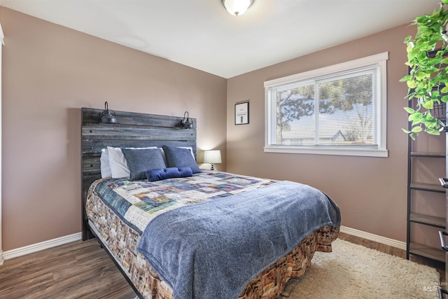 bedroom featuring dark hardwood / wood-style flooring