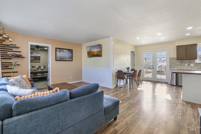 living room with light hardwood / wood-style floors and french doors