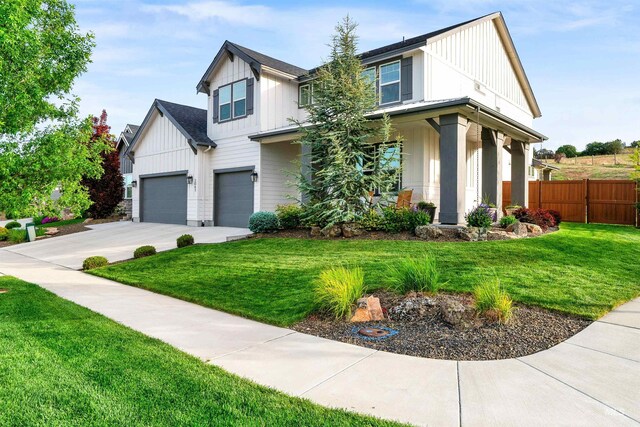 2043 E Lodge Trail Dr, Meridian, ID 83642 - modern inspired farmhouse with board and batten siding, concrete driveway, and an attached garage