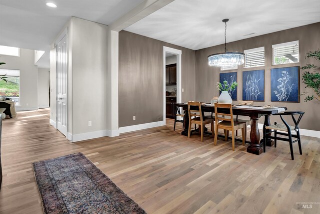 2043 E Lodge Trail Dr, Meridian, ID 83642 - dining room featuring baseboards, a chandelier, light wood-type flooring, healthy amount of natural light, and recessed lighting