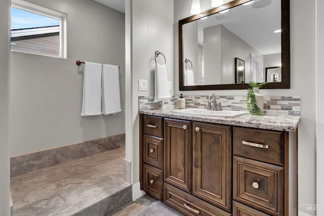 2043 E Lodge Trail Dr, Meridian, ID 83642 - bathroom featuring tasteful backsplash and vanity