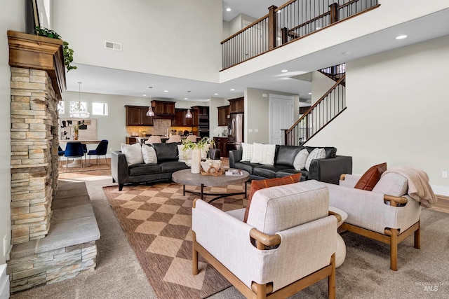 2043 E Lodge Trail Dr, Meridian, ID 83642 - living room featuring a high ceiling, stairs, recessed lighting, and carpet flooring
