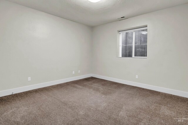 2043 E Lodge Trail Dr, Meridian, ID 83642 - unfurnished room with baseboards and dark colored carpet
