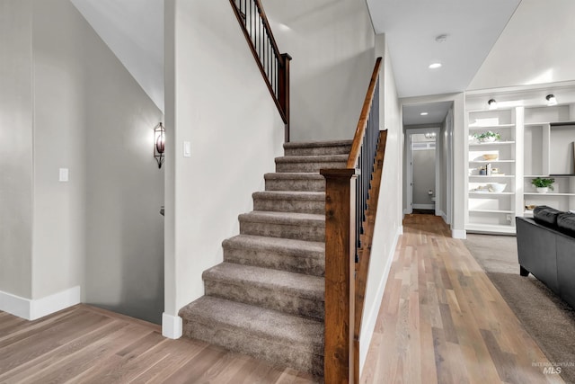 2043 E Lodge Trail Dr, Meridian, ID 83642 - stairs with wood finished floors, baseboards, built in shelves, and recessed lighting