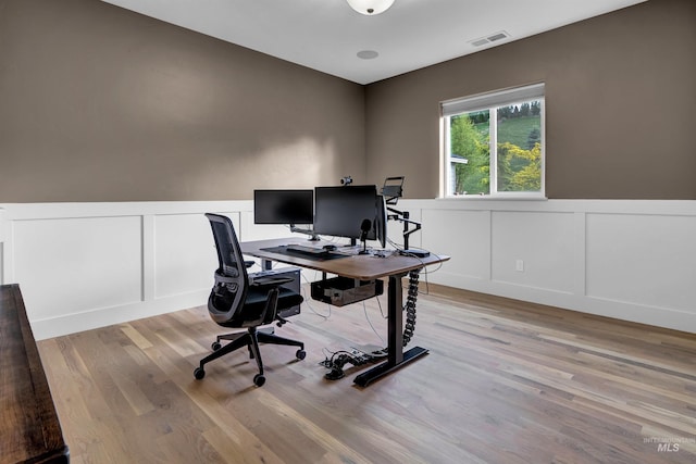 2043 E Lodge Trail Dr, Meridian, ID 83642 - office area featuring a decorative wall, light wood-style flooring, and wainscoting