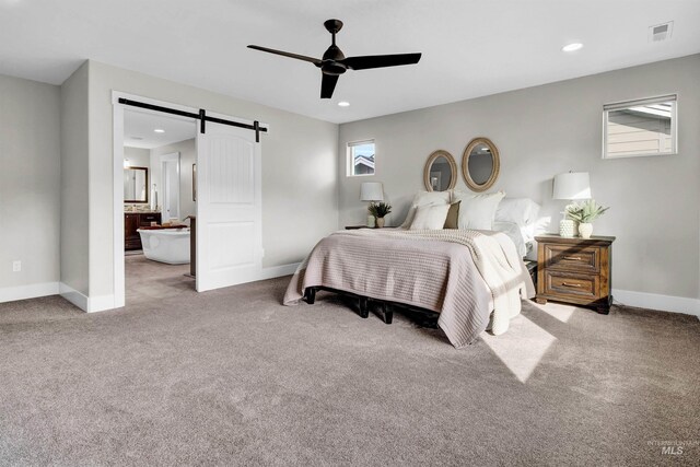 2043 E Lodge Trail Dr, Meridian, ID 83642 - carpeted bedroom with a barn door, baseboards, recessed lighting, and a ceiling fan