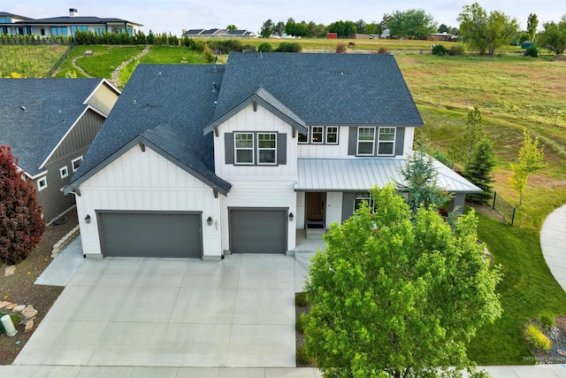 2043 E Lodge Trail Dr, Meridian, ID 83642 - modern farmhouse style home with board and batten siding, roof with shingles, driveway, and a garage