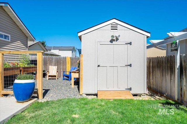 view of shed featuring a fenced backyard