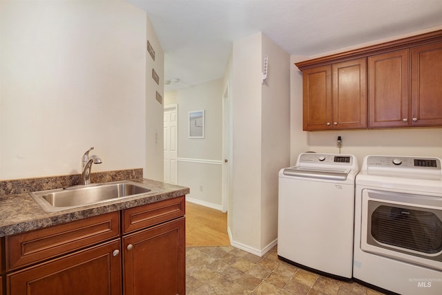 426 Carriage Ln, Twin Falls, ID 83301 - clothes washing area with washer and dryer, cabinet space, and baseboards