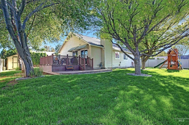 426 Carriage Ln, Twin Falls, ID 83301 - view of yard with a playground, a deck, a storage shed, and an outbuilding