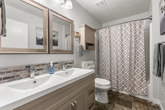 2208 Keithley Creek Rd, Midvale, ID 83645 - full bath featuring double vanity, tasteful backsplash, shower / tub combo, a textured ceiling, and stone finish flooring