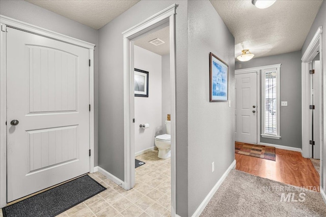 2030 W Cabot Ave, Nampa, ID 83686 - foyer featuring visible vents, baseboards, and a textured ceiling