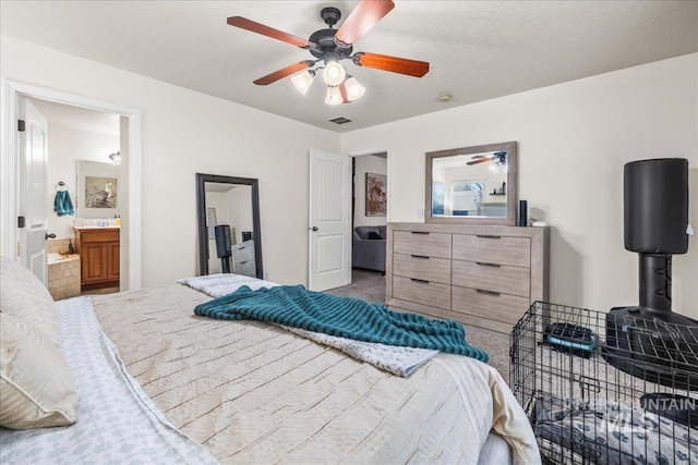 2030 W Cabot Ave, Nampa, ID 83686 - bedroom with visible vents, ensuite bath, ceiling fan, and carpet floors
