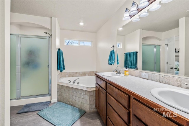 2030 W Cabot Ave, Nampa, ID 83686 - full bathroom featuring double vanity, a bath, a stall shower, and a sink