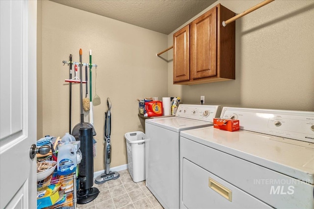 2030 W Cabot Ave, Nampa, ID 83686 - washroom featuring baseboards, cabinet space, a textured ceiling, and washing machine and dryer