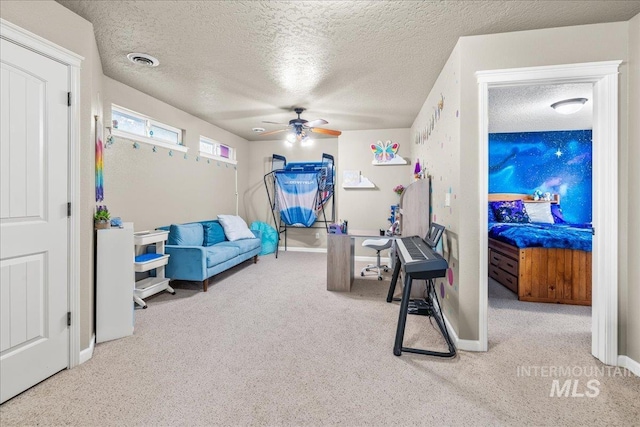 2030 W Cabot Ave, Nampa, ID 83686 - exercise room with visible vents, a textured ceiling, carpet flooring, baseboards, and ceiling fan