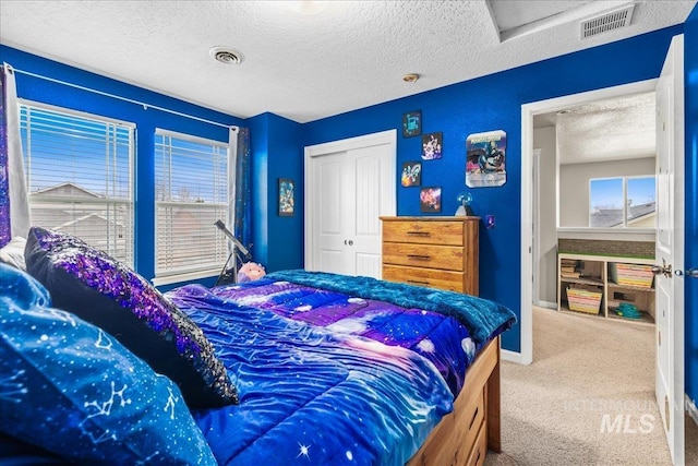 2030 W Cabot Ave, Nampa, ID 83686 - bedroom with a closet, visible vents, carpet floors, and a textured ceiling