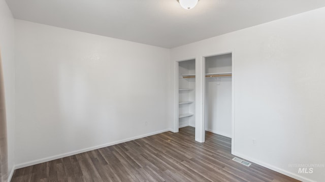 219 14th Ave N, Nampa, ID 83687 - unfurnished bedroom with wood finished floors, baseboards, and a closet